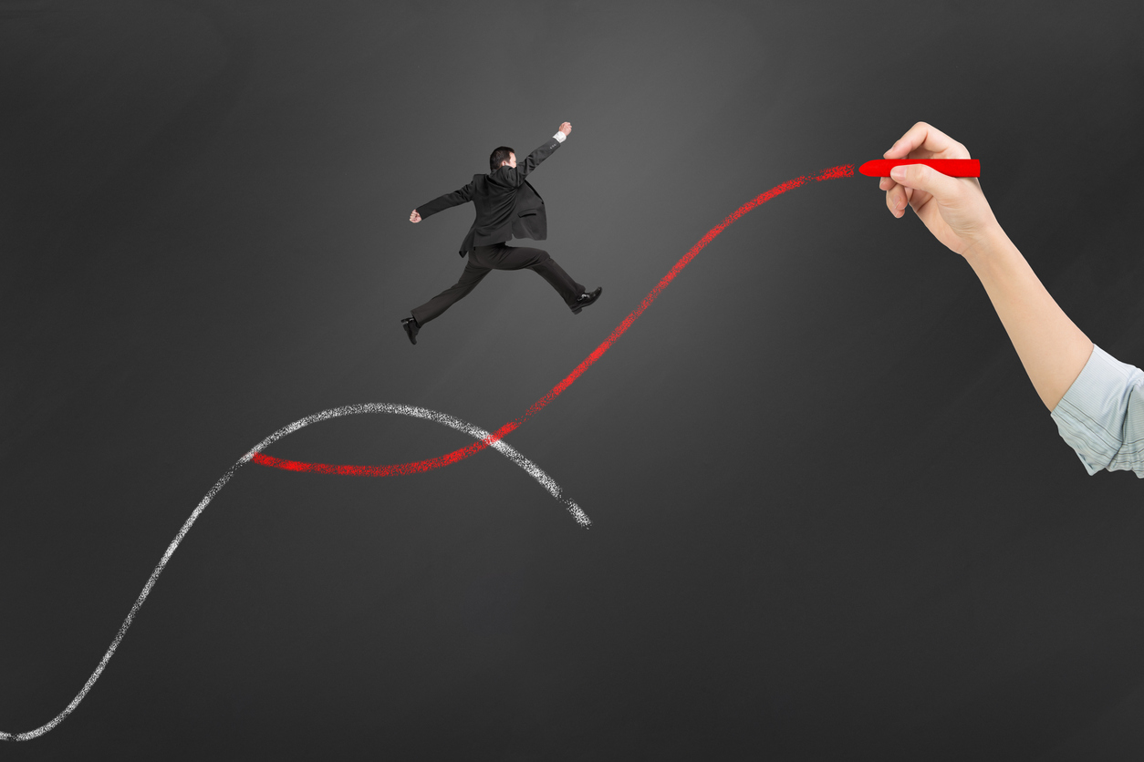 The second curve concepts, woman hand holding chalk drawing two curves with businessman jumping.